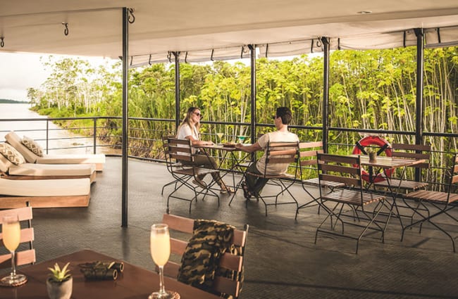A couple relaxing on the outdoor deck