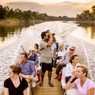 Group of people in a skiff on Amazon excursion