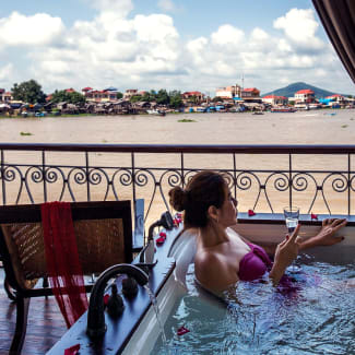 A woman in a jacuzzi on the terrace