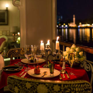 Romantic dinner set up at the balcony of the suite