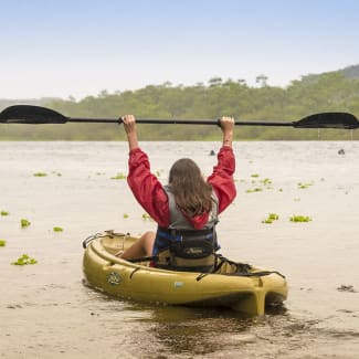 A woman in the kayak on the Amazon river