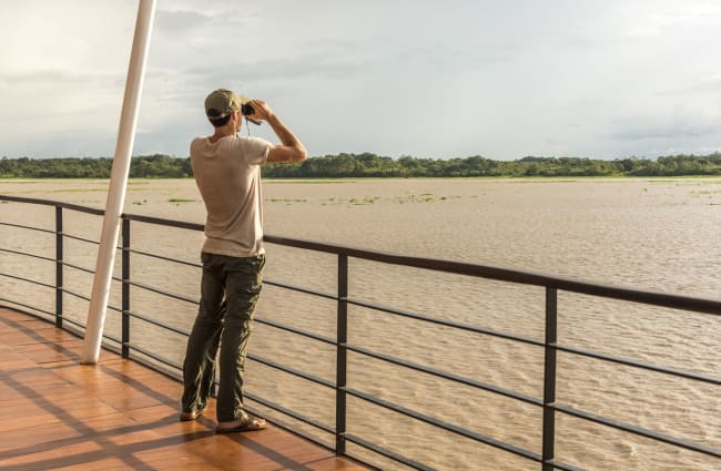 Man looking through the binoculars